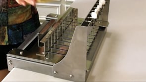 multiple-bar stainless steel soap cutter in action