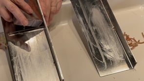 Heavy-duty bladeless stainless steel soap trimmer in action.